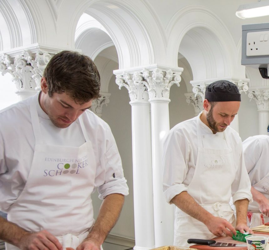 Professional cook school chefs preparing food during cookery course
