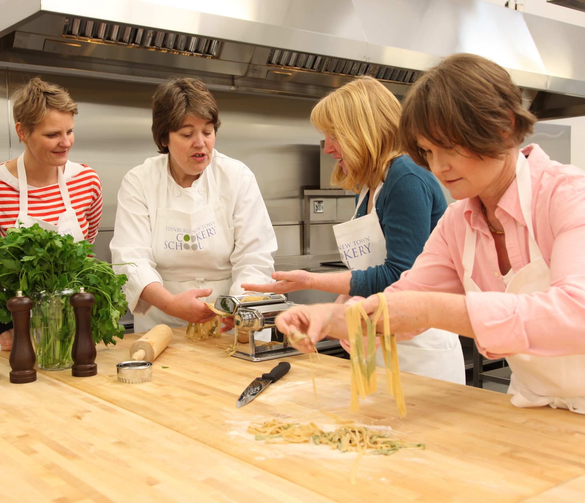 Fiona Burrell principal of Edinburgh New Town Cookery School teaches students to cook on the Italian cookery course